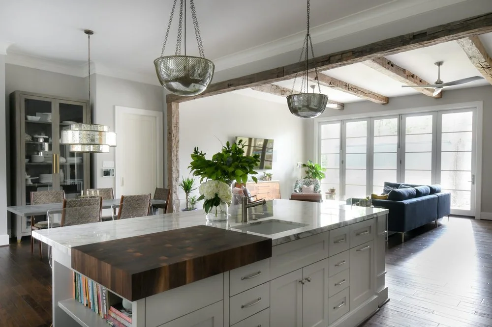 KM Builders Beverly Hills kitchen with an island, exposed wood detailing, and connected living space